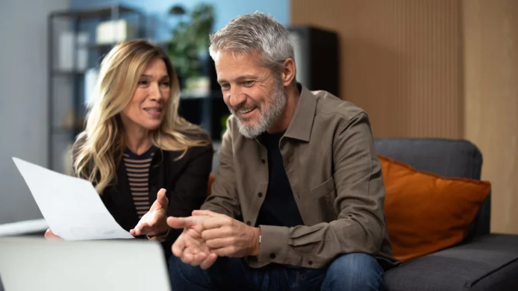 Mature couple discussing financial planning with advisor