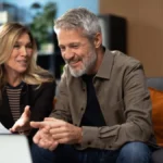 Mature couple discussing financial planning with advisor