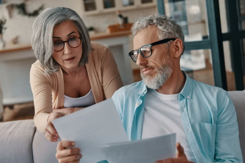 Concentrated senior couple in casual clothing