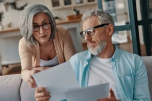 Concentrated senior couple in casual clothing