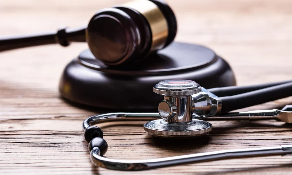 Gavel And Stethoscope On Table