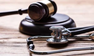 Gavel And Stethoscope On Table
