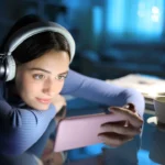 Woman watching media on smart phone in the night at home