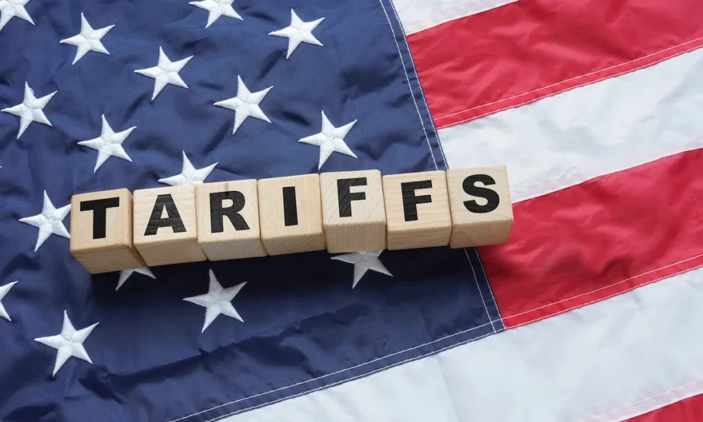 Import Trade Tariffs increase concept with United States of America Flag. Trade wars