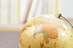 Focus,Globe,And,Blur,Bookshelf,Behind.,Learning,,Study,,Knowledge,And