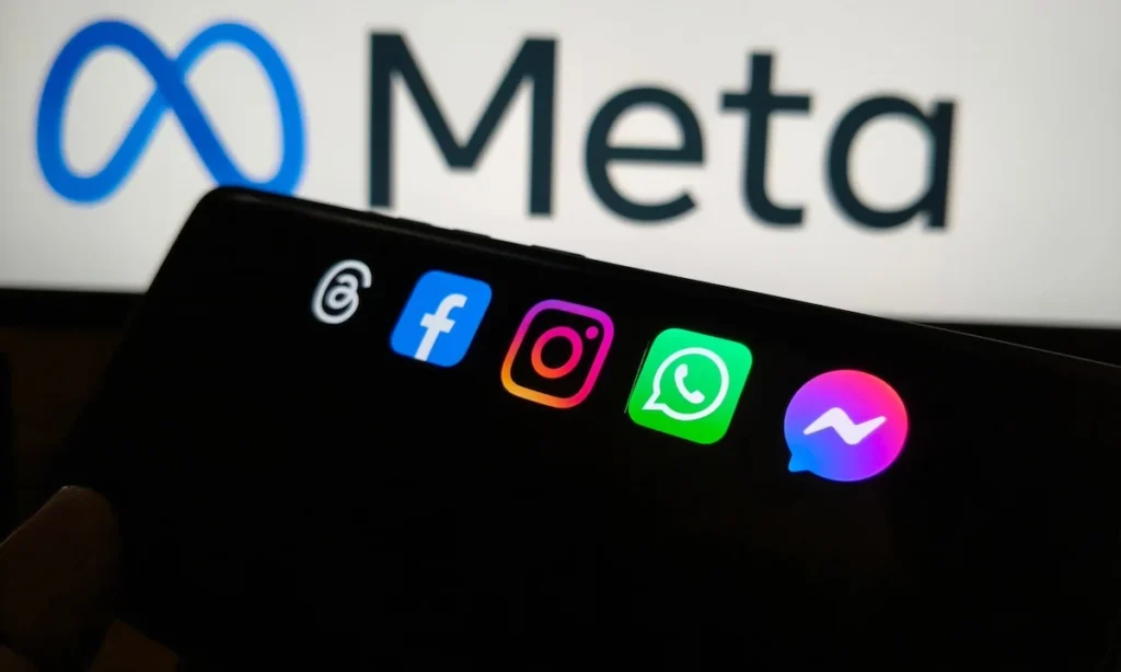 Meta apps on a smartphone with the meta logo in the background, New York City, 21 November 2025