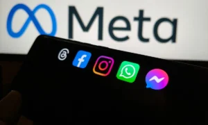 Meta apps on a smartphone with the meta logo in the background, New York City, 21 November 2025