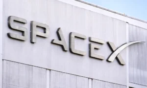 Dec 8, 2019 Hawthorne / Los Angeles / CA / USA - close up of SpaceX (Space Exploration Technologies Corp.) sign at their headquarters; SpaceX is a private American aerospace manufacturer