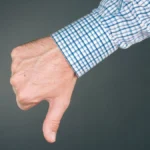 Dislike and disapprove hand gesture with thumb down