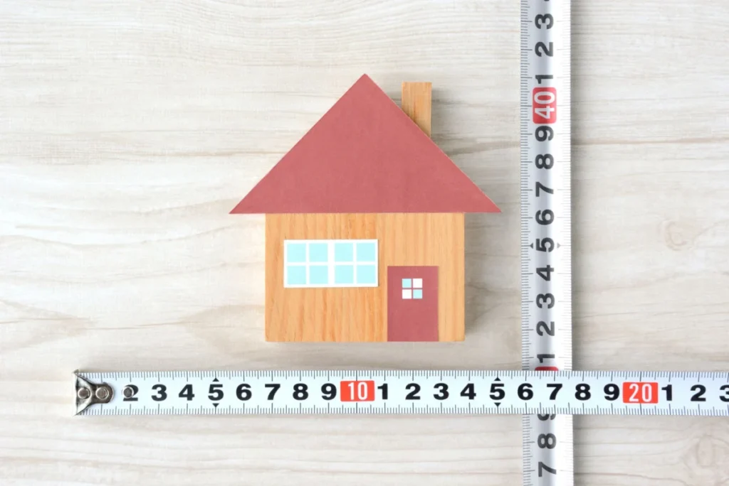 House object and tape measure, measuring house size images