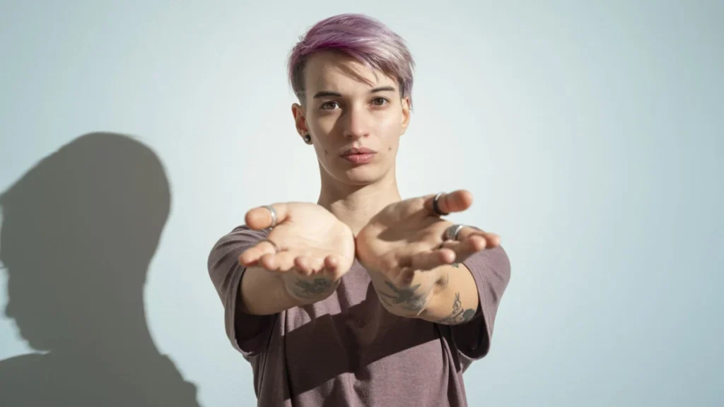 Woman reaching hands toward camera