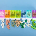 Vitamins and supplements. Variety of vitamin tablets in a jar on a texture background.Multivitamins with fresh and healthy fruits.Food supplements. Flat lay. Space for text.Copy space