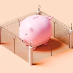 Pink Piggy Bank Behind Barbed Wire and Cameras - Security Concept