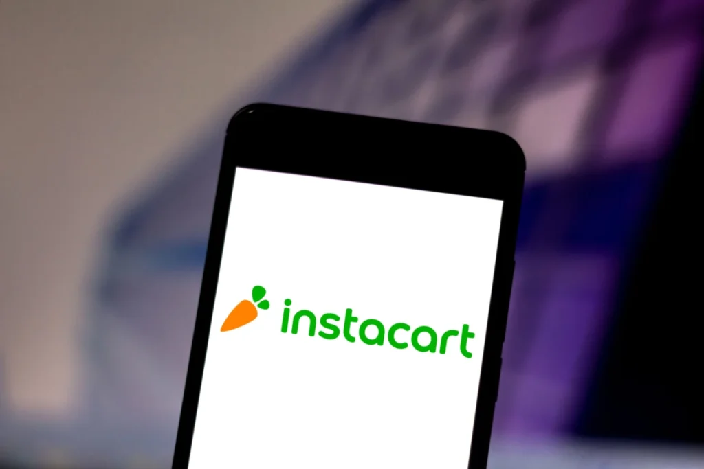 In this photo illustration the Instacart logo is seen