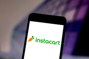 In this photo illustration the Instacart logo is seen