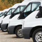 commercial delivery vans in row at parking place of transporting